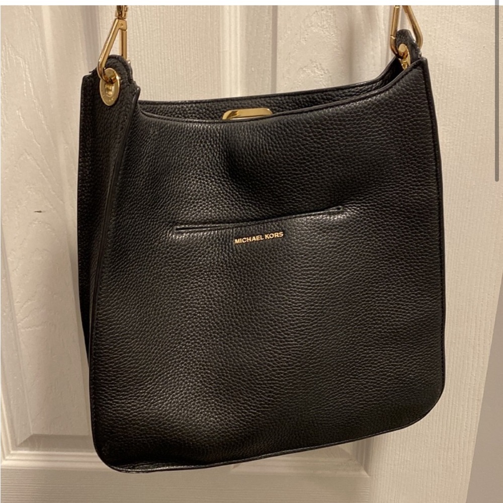 Michael kors leather messenger bag.